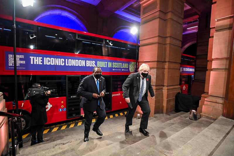 A London red bus drops Prime Minister Boris Johnson at a COP26 reception at the Kelvingrove Art Gallery, Glasgow