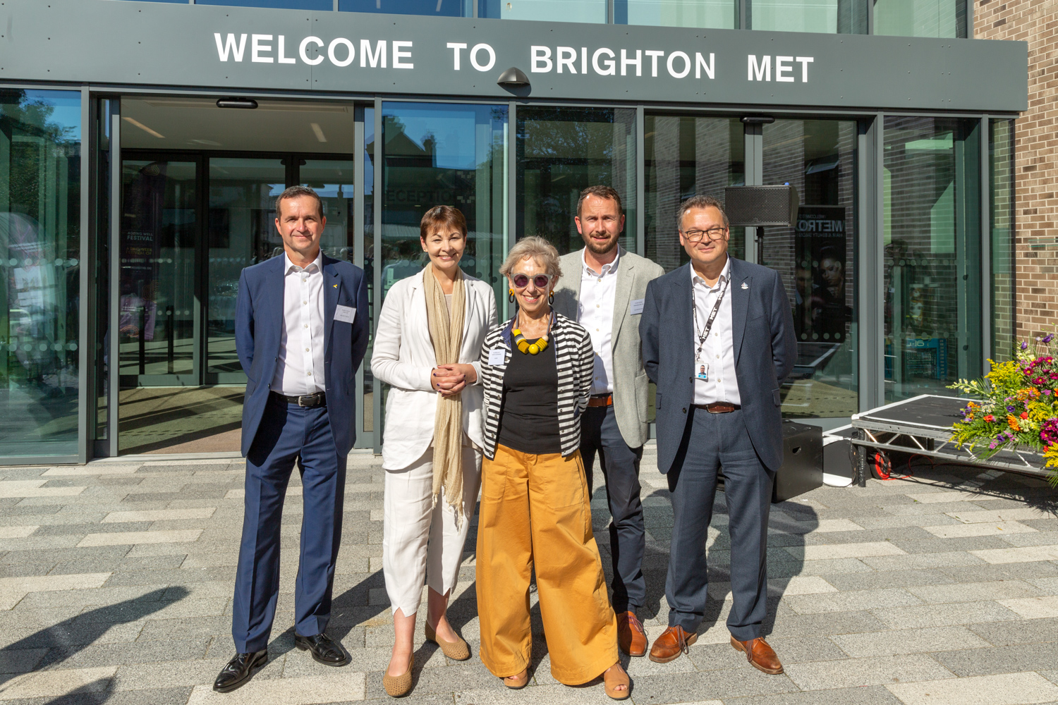 Willmott Dixon Director Russell Miller, Caroline Lucas MP, GB MET Chair of Governors Sue Berelowitz, ECE Architecture Managing Director Stuart Eatock, and GB MET CEO Andy Cole outside of the new Brighton MET building.