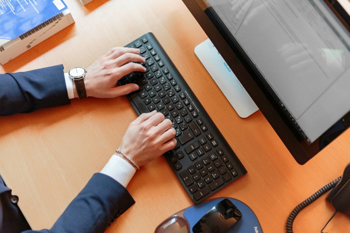 Someone's hands using a computer keyboard