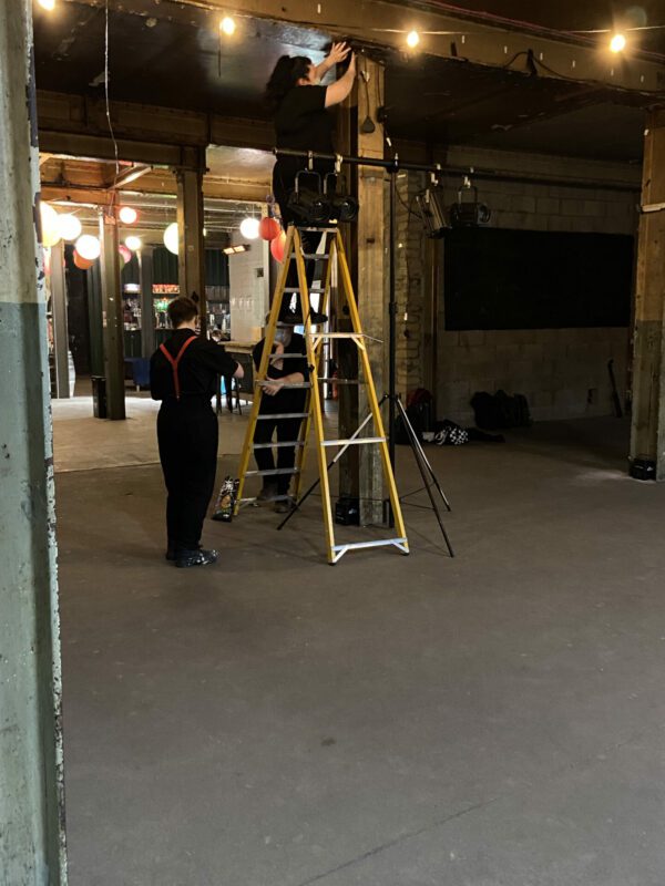 Shannon Cassidy is pictured on the ladder in the main image with Matt McGowan below, during set up at the Leith Comedy Festival which took place at The Biscuit Factory in Leith.