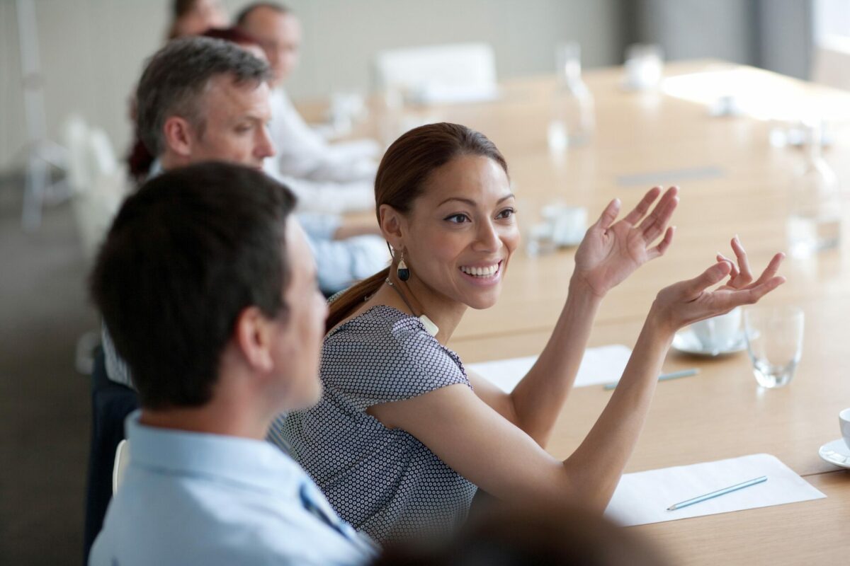 smiling business woman at board meeting