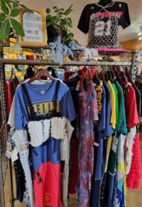 Clothing is hung in a display in the Beyond Retro store