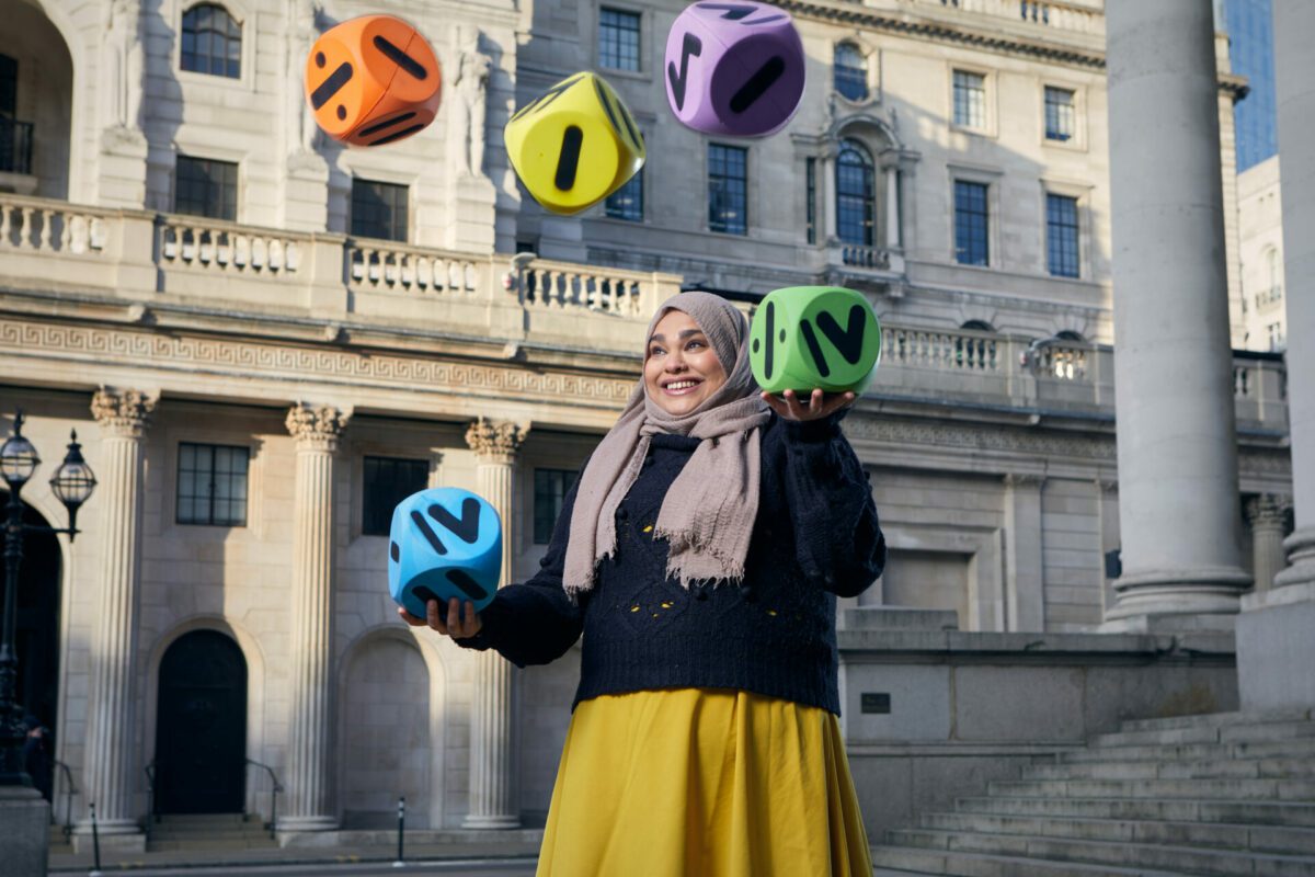 Farha Jamadar juggling cubes with mathematic symbols on