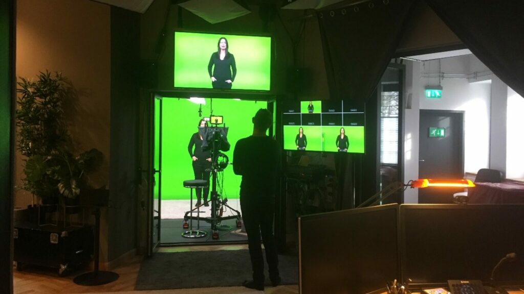 Guildhawk team at green screen studio creating new virtual human human avatar twin for multilingual videos