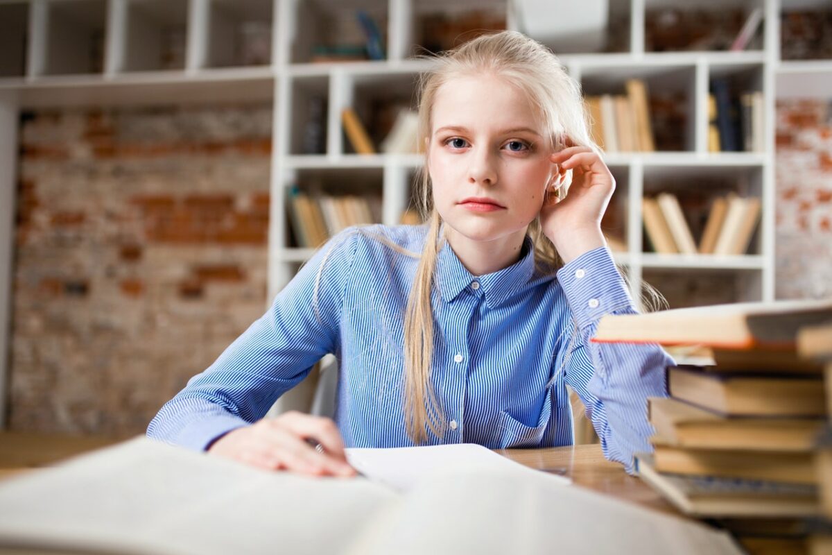 Photo by George Dolgikh @ Giftpundits.com: https://www.pexels.com/photo/woman-sitting-next-to-table-and-right-hand-on-ear-1326946/