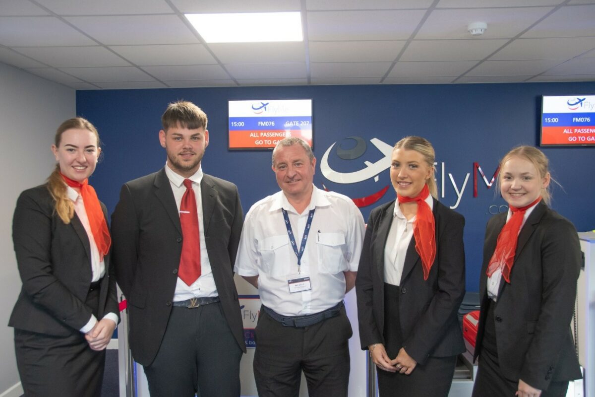 Barnsley College Travel and Tourism students with Roy Kelly, Retired Pilot and Pilot Instructor at FlyMe (middle).