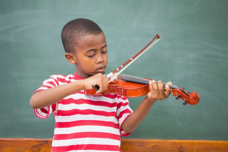male child playing violin