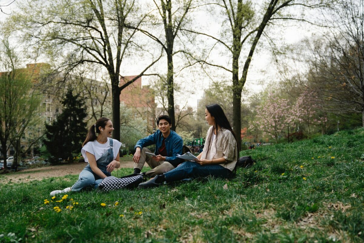 students sat on grass