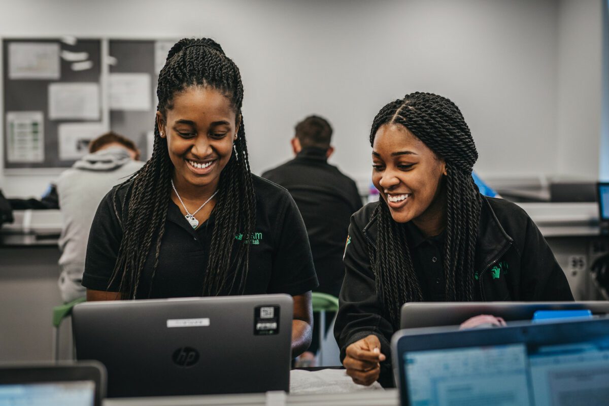 Two Leeds College of Building students at their computers learning design.