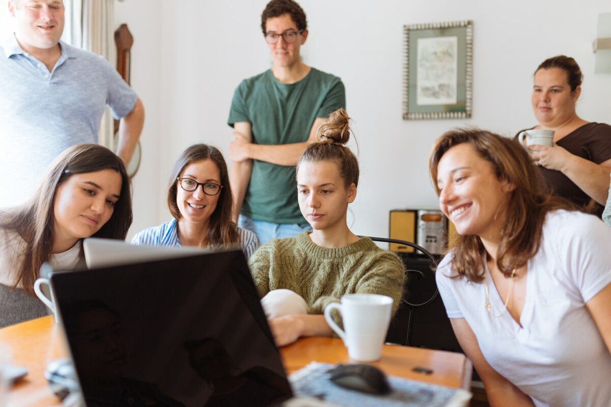 People looking at computer