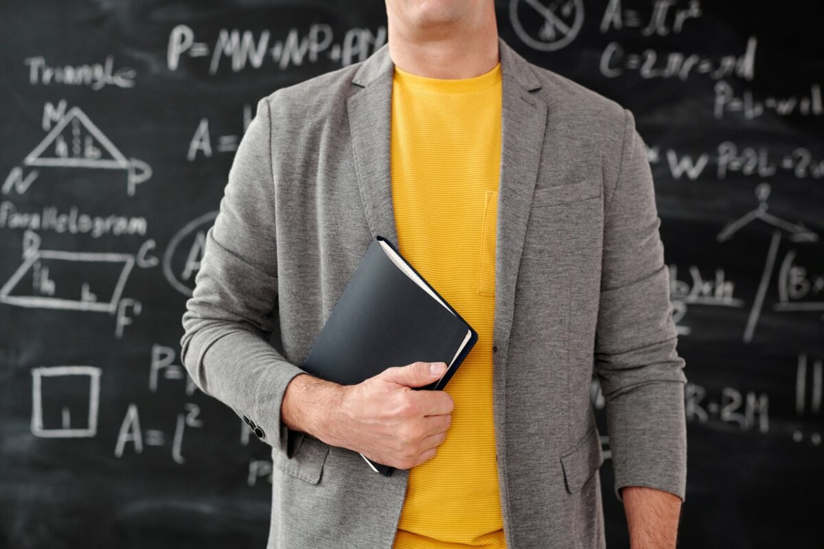 Teacher in front of blackboard