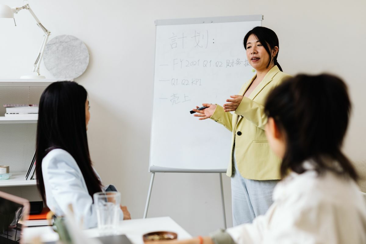 women looking at presentation board