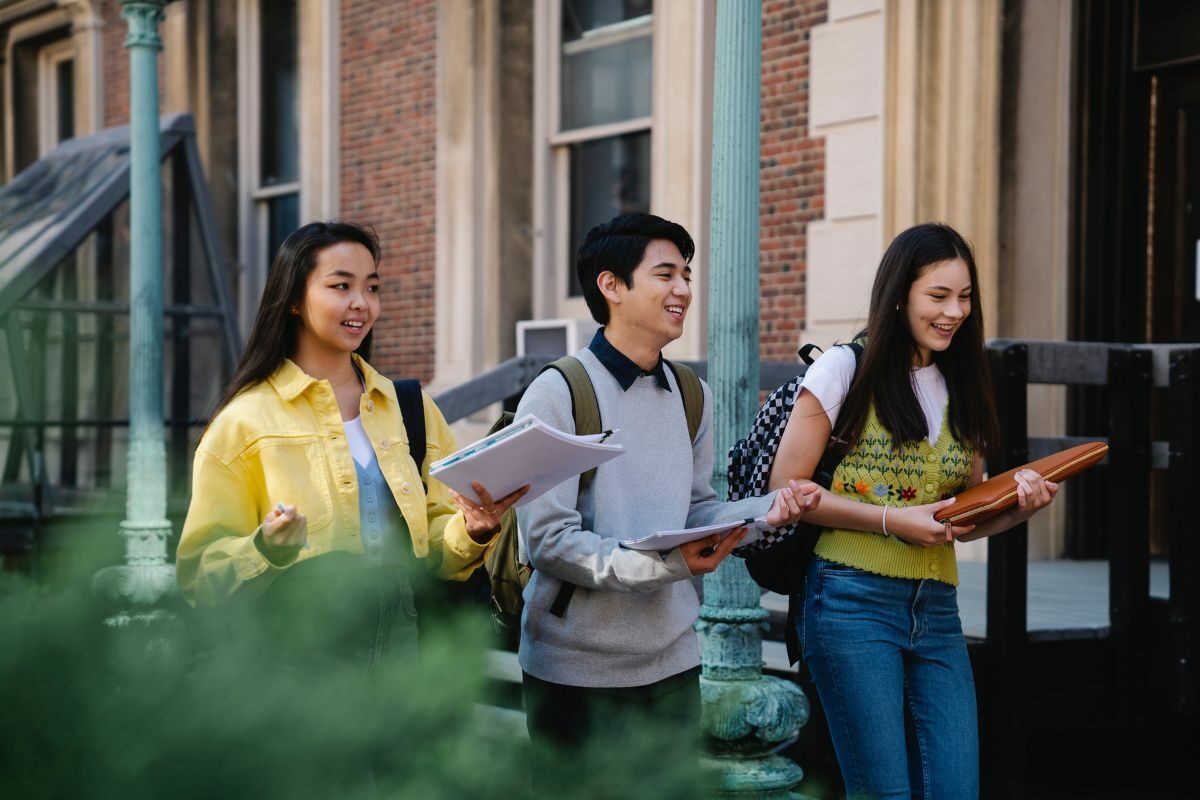 Students walking holding books