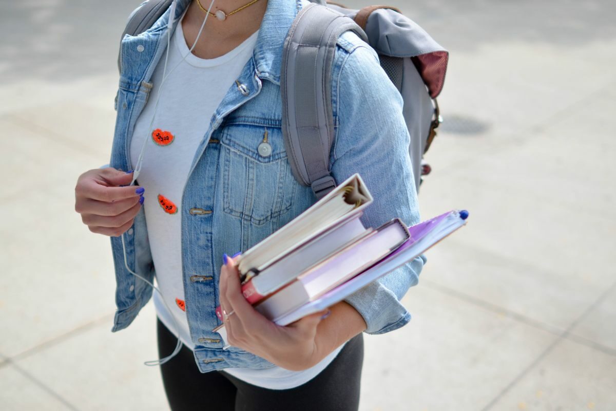 person holding books