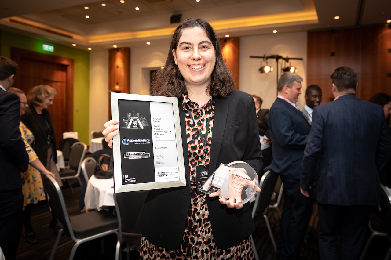 A female Transport Planning Technician Apprentice holds her award at the regional final.