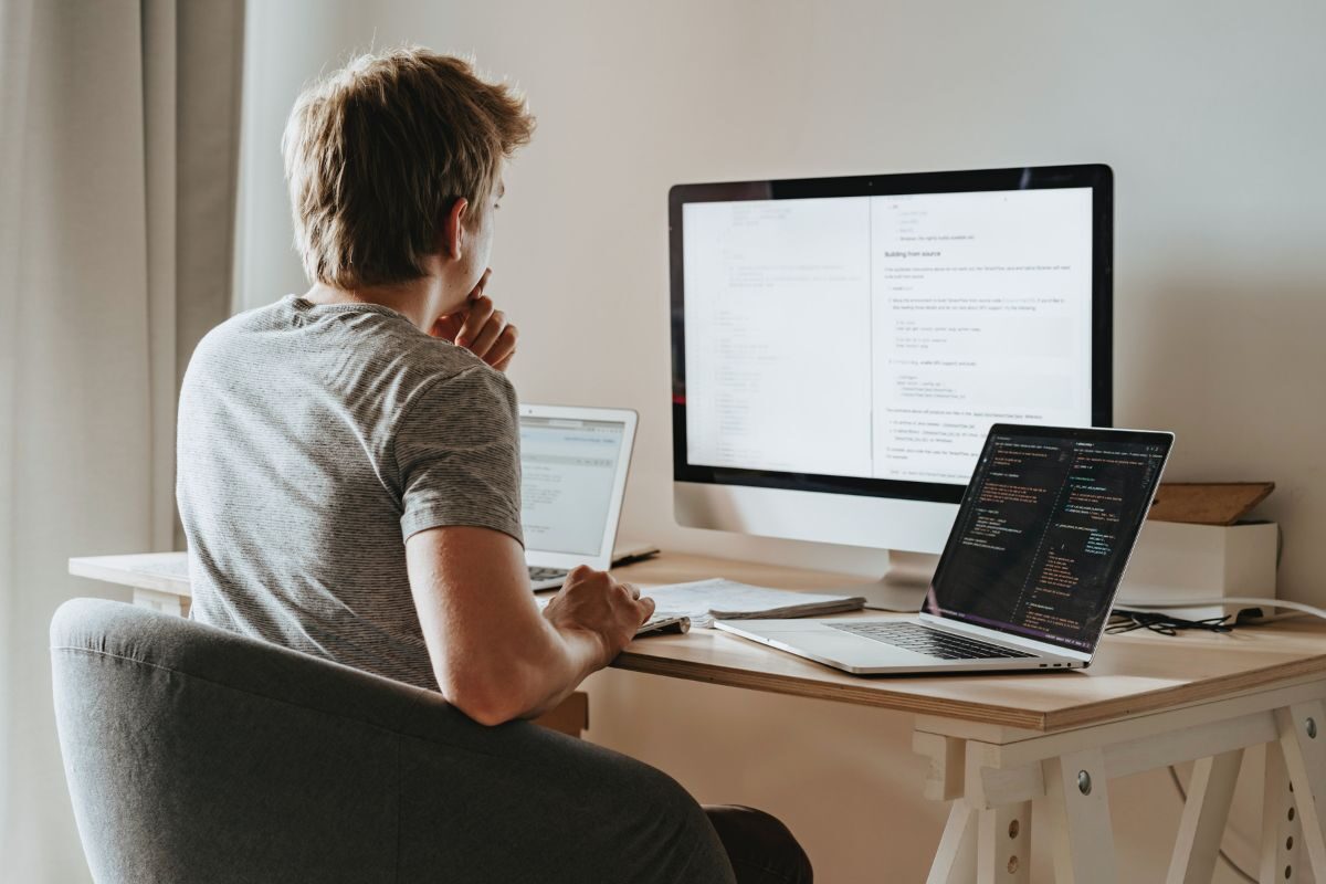 man looking at computer