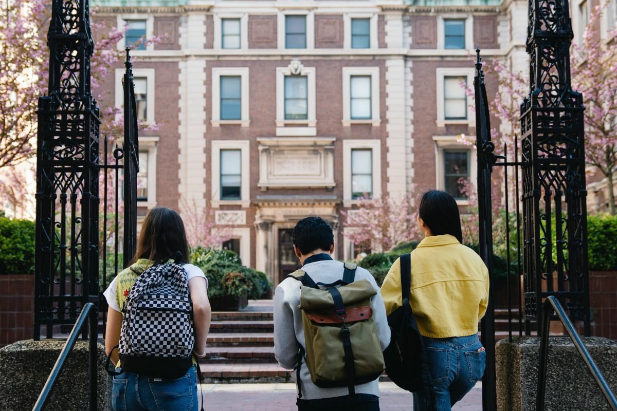 students walking through gate