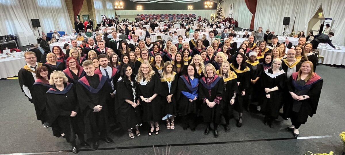 Group of graduates and staff