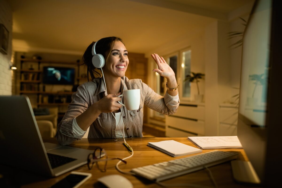 woman working from home with headphones on
