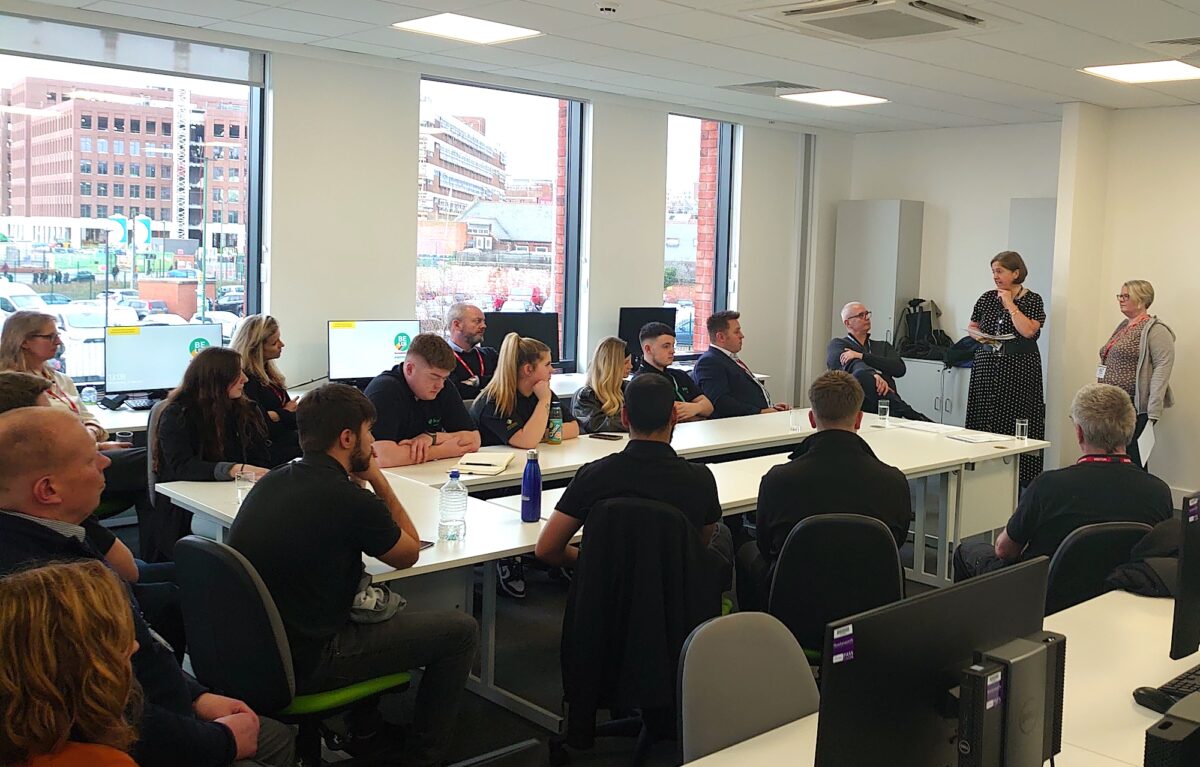 A group of civil engineering apprentices in a Leeds College of Building boardroom listening to a talk by employers BAM Nuttall Ltd.