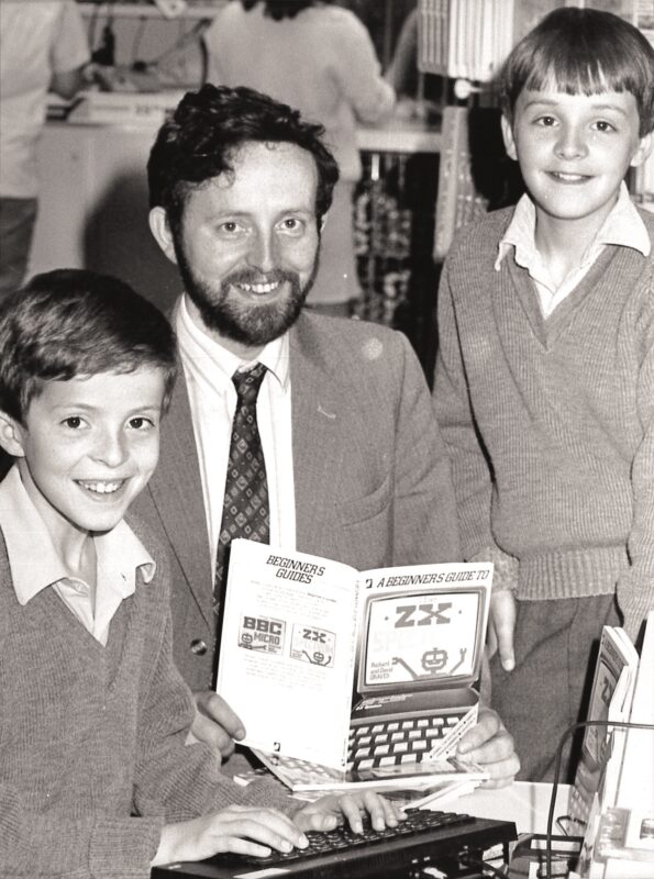 Philip, Richard and David Graves, pictured in the 1980s with one of the users' guides to computers