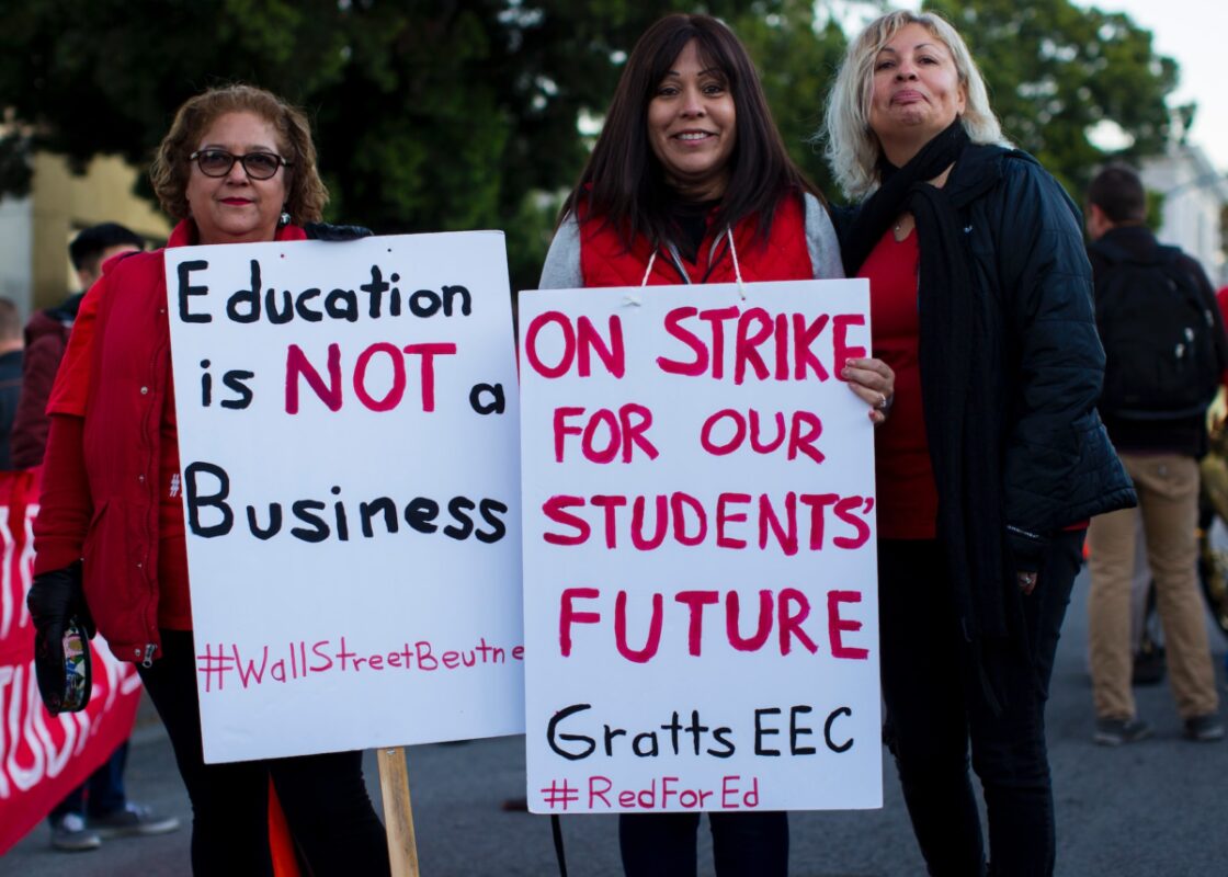 females holding strike signs