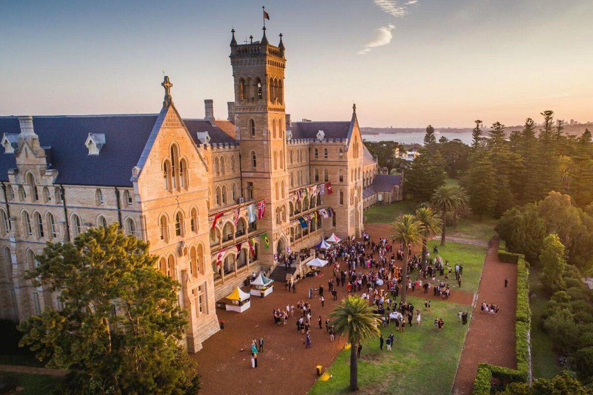 An image of the International College of Management Sydney (ICMS) campus decorated with international flags. This image is being used on FE News to announce the partnership between CTH and ICMS.