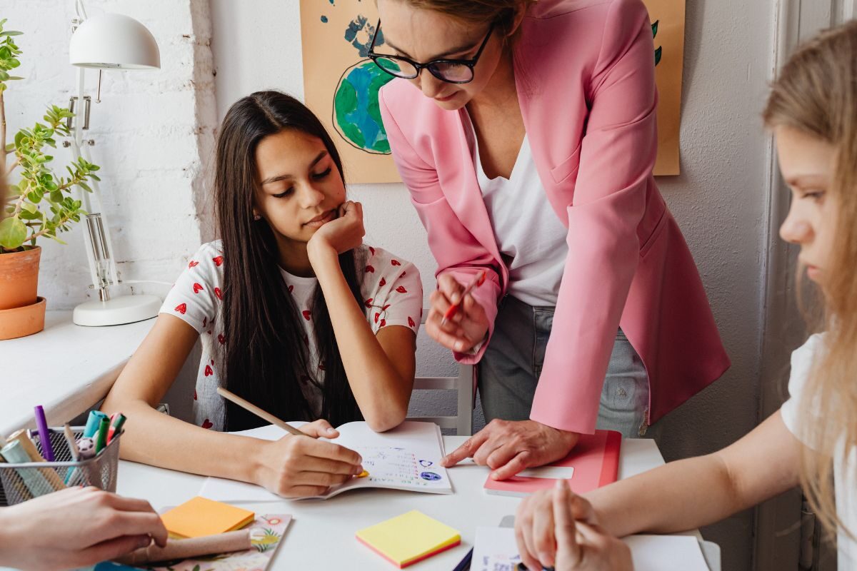 teacher helping students