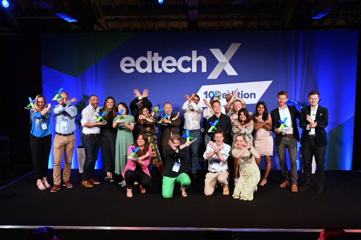 The winners of the 10th edition of EdTechX on stage holding big X's