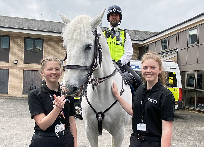 Havering Sixth Form students spoke to police officers, tried equipment and met police dogs and a horse who was in the Coronation procession for King Charles at a Met Police visit