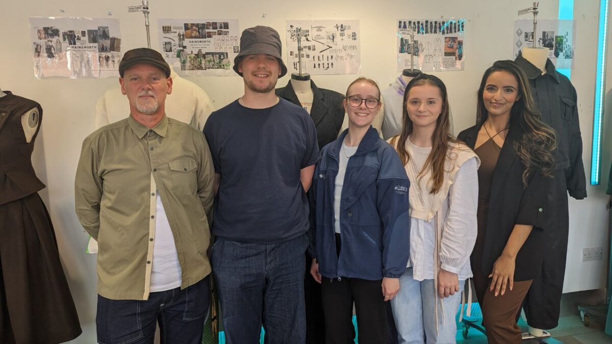 A photograph of the MMU course tutor and students who took part in the live brief competition to create a sustainable garment using Hainsworth fabrics.
