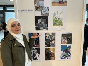 Mariam Eish with artwork she made at the Creative End of Year Show 2023
