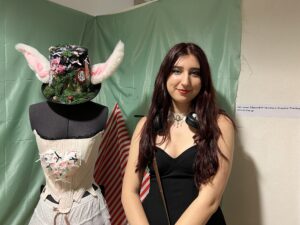 Renata Varga with clothes she designed at the Creative End of Year Show 2023