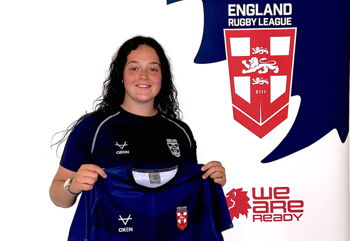 Leeds College of Building Painting & Decorating apprentice, Ellie-Mae Wainhouse, holding her England shirt.