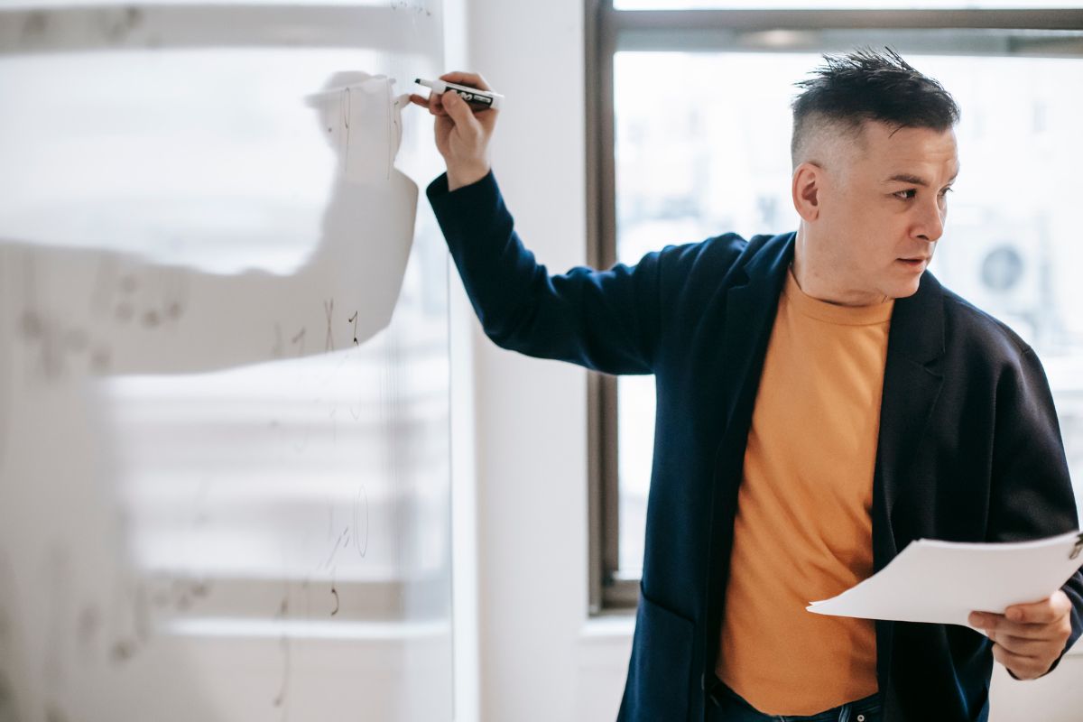 teacher writing on board