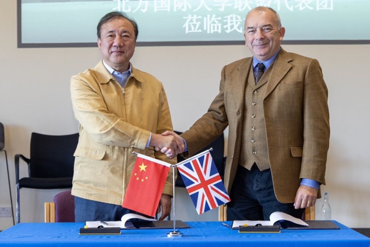 Professor John Latham CBE, Vice-Chancellor of Coventry University Group with Weichang Yang, CEO of Beifang International Education Group (BIEG)