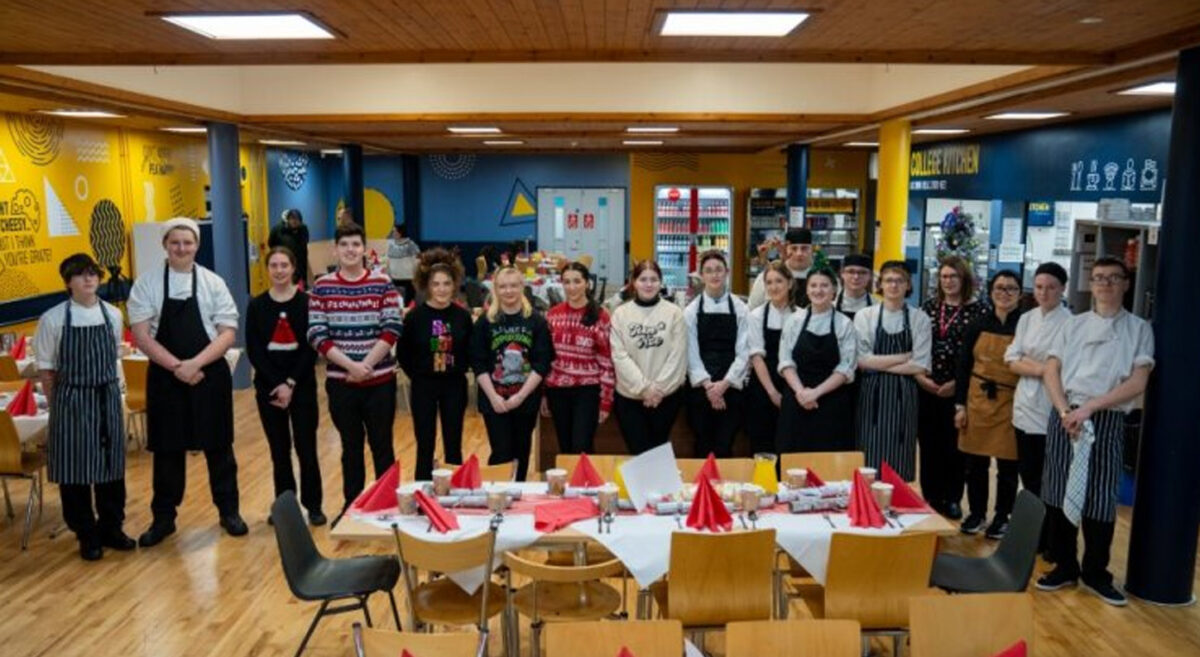 Christmas Cheer on Campus: Students from South Eastern Regional College ready to serve a festive meal they prepared for local carers and foodbank clients at the College’s Bangor Campus.