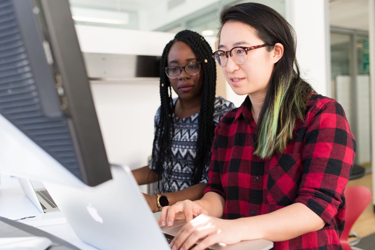 two people working on a computer