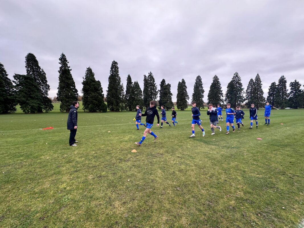 HoW Academy training for football on grass