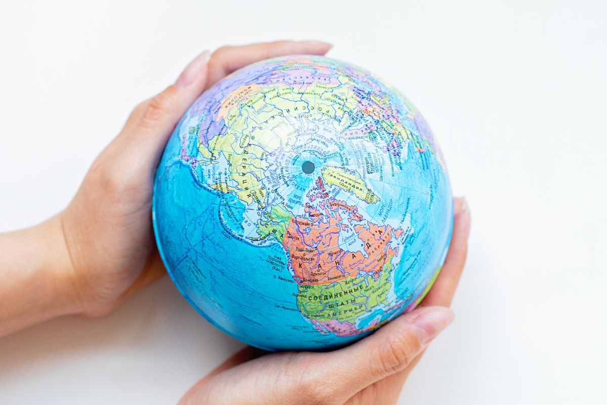 hands holding a globe