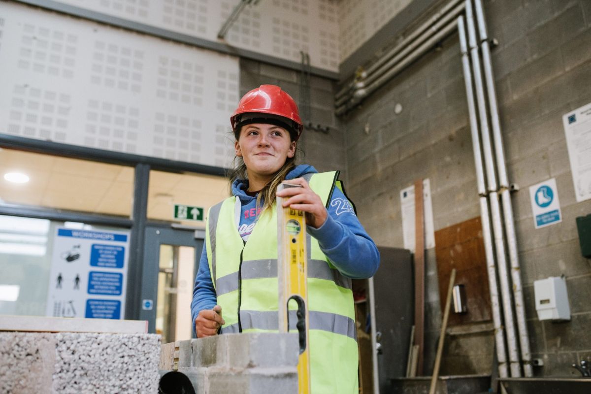 South West College young women apprentice in work gear