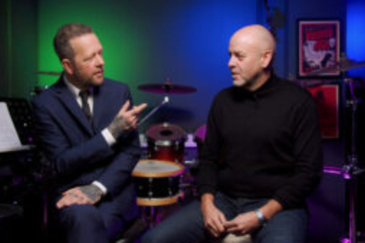 2 guys sitting and on being interviewed