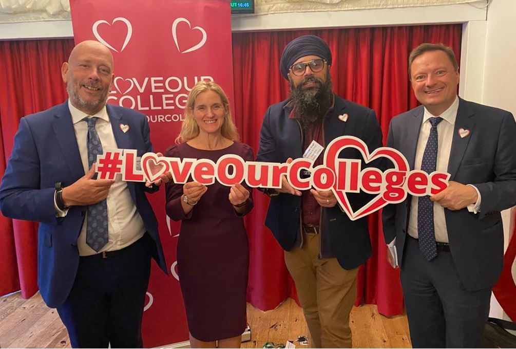 Mark Eastwood MP, Kim Leadbeater MP, Palvinder Singh Principal of Kirklees College and Jason McCartney MP stand in a row holding a sign that says #LoveOurColleges