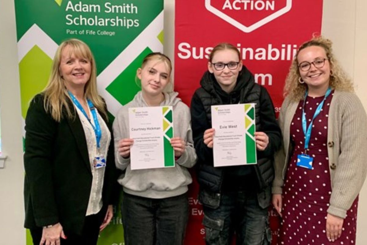 students holding certificates