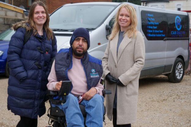 2 women and a disabled student in a wheel chair