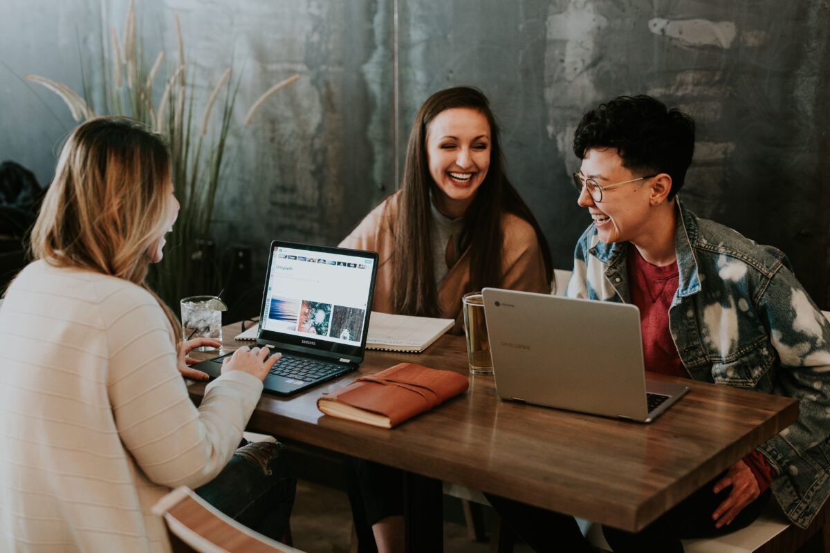 people laughing on a table