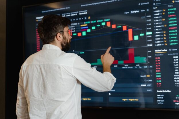 Data, man looking at data sets on a big interactive screen, Pexels Stock