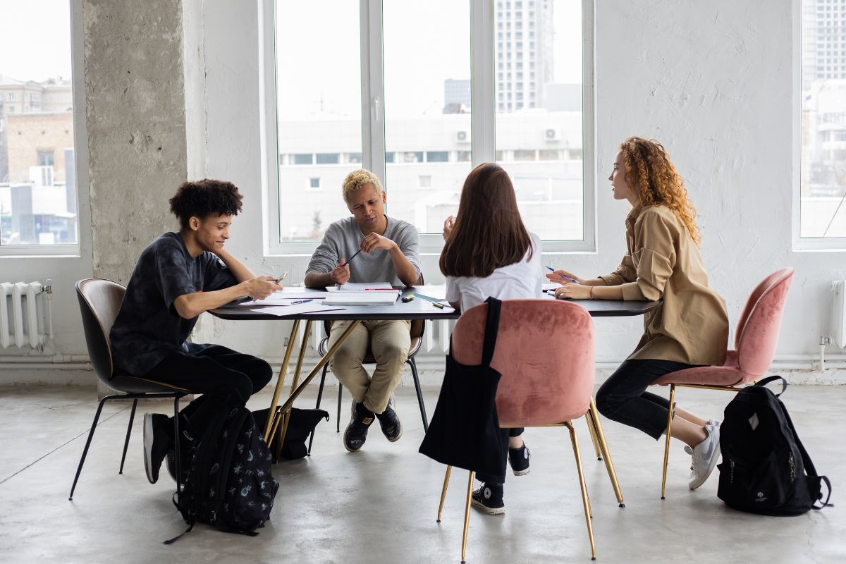 Students at a table working, Pexels Stock