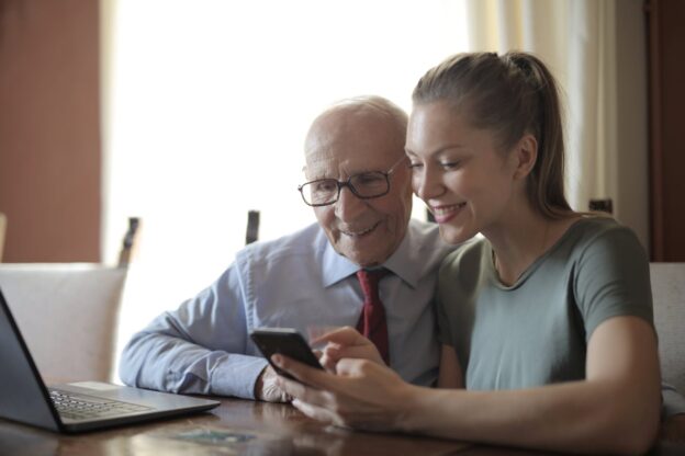A young carer helping an older family member