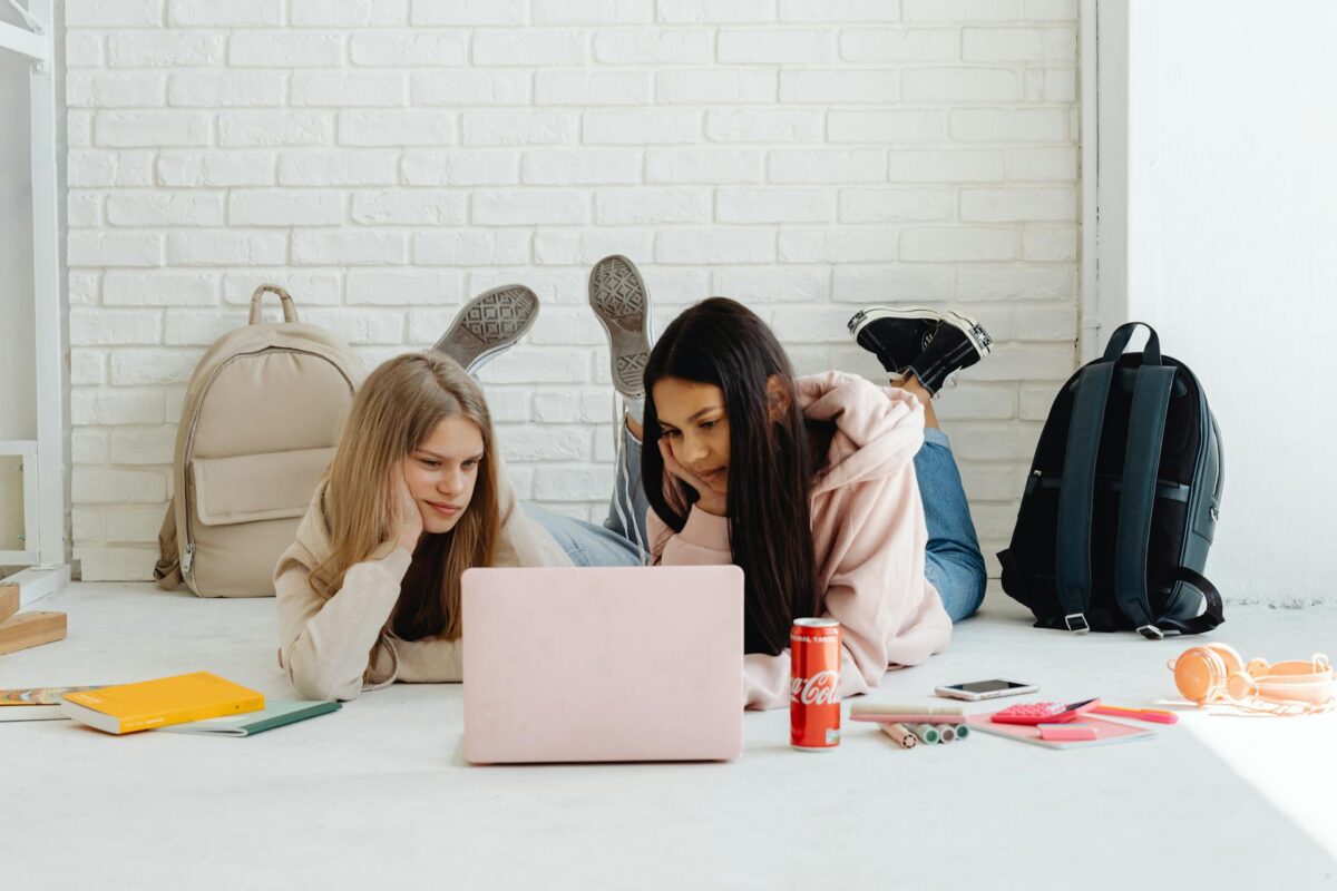 Two Girls Looking At A Laptop